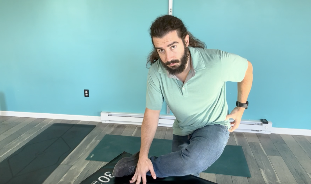 Dr. John Demonstrating standing pigeon to improve hip mobility