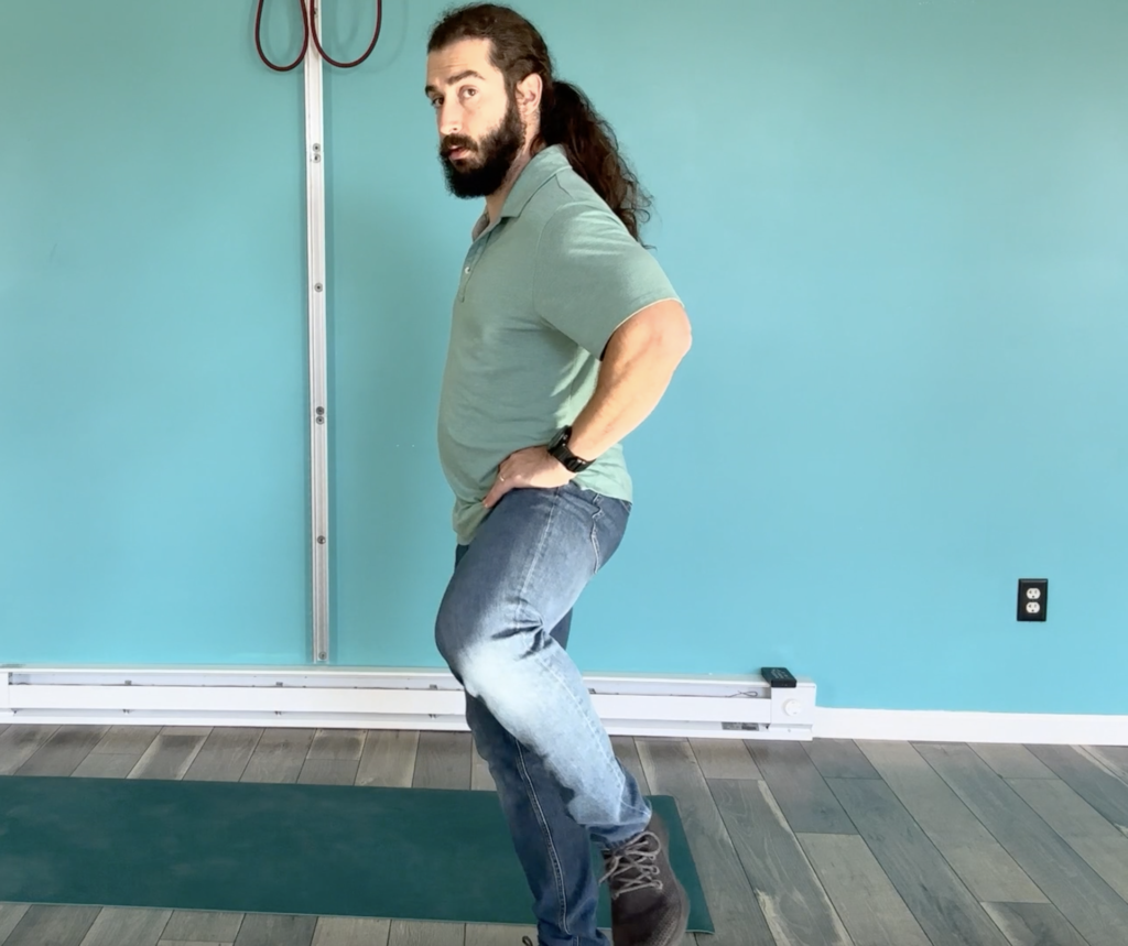 Dr. John doing hip circles to increase hip mobility
