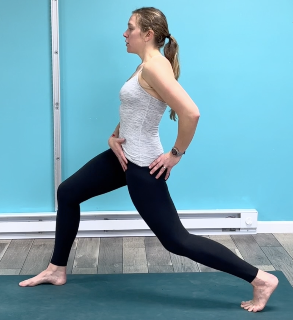 Dr. Chloe demonstrating a standing stretch