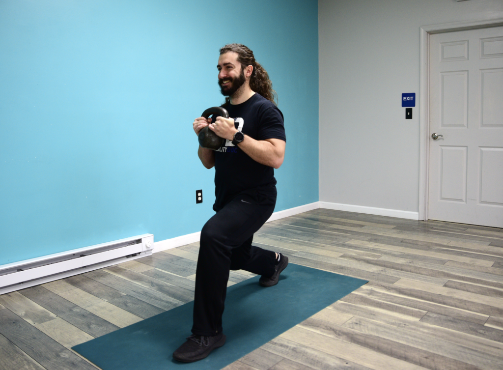 John doing single leg lunges during a primer