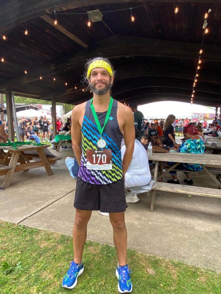 Jeremy with his medal after his most recent 5k