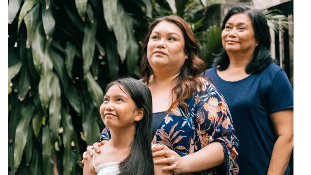 a grandmother, mother, and daughter showing generational women.