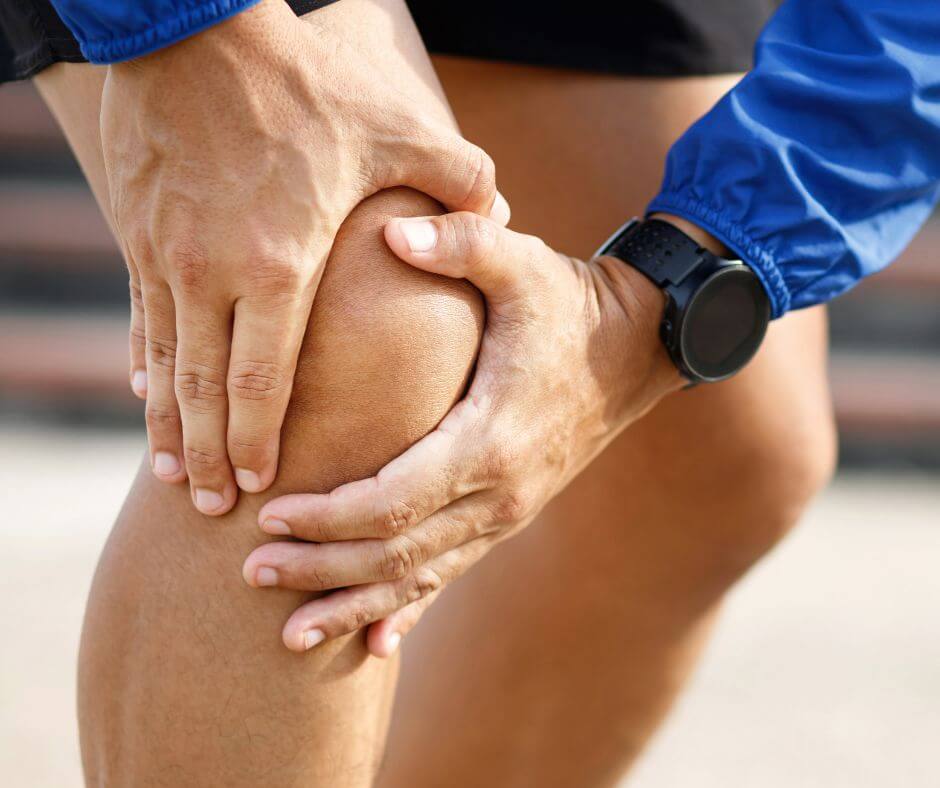 photo of someone grabbing the knee for understanding arthritis