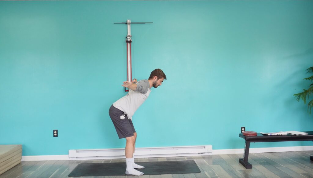 Dr. Jon in a hinged position with his arms stretched out in a T position