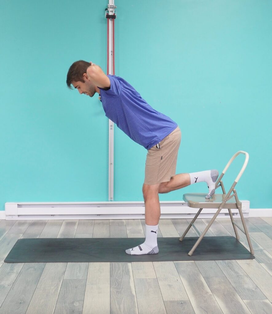 Jon doing an RDL but this variation is hands behind his head elbows out to the sides while he hinges forward
