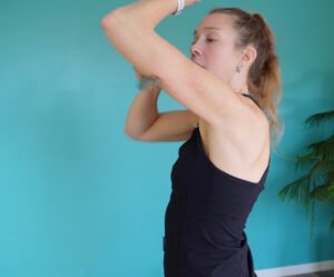 Version 1 - muscle scraping the tricep while stanind with elbow elevated to 45 degrees above the shoulder