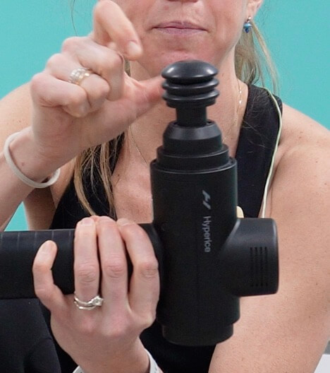 showing the hypervolt 2 pro with the soft more flat massage gun head attachment